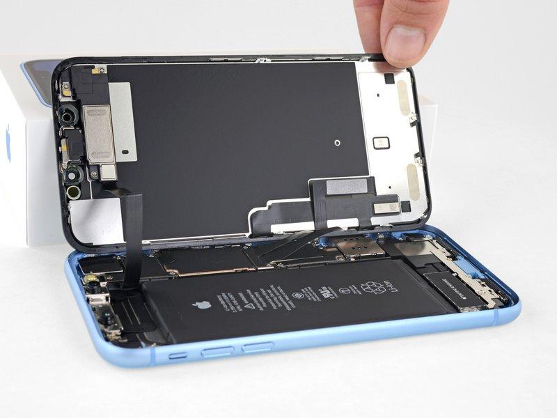 During reassembly, lay the display in position, align the clips along the top edge, and carefully press
