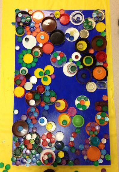 Recycled Bottle Lids Art Invite children to recycle