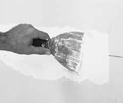 For a large crack, remove the section and any fasteners with a hammer or screw gun. Measure and cut a new gypsum board panel to fit the damaged area. Fasten it to the studs.
