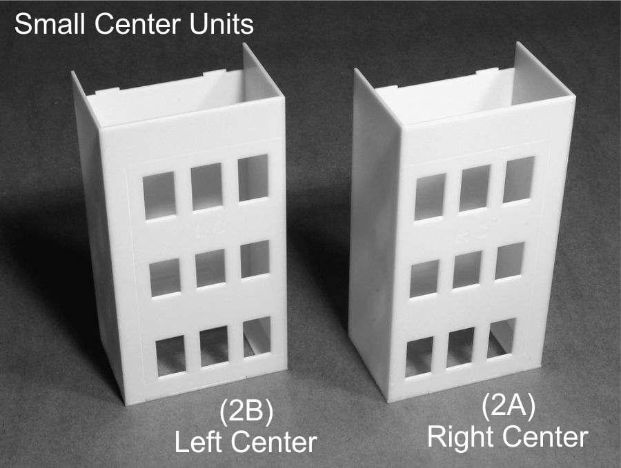 For Unit 1, place the tabs of the right center wall (2A) into the slots on Side (1) of the Base and glue into place. Glue one half of the Common wall to either side of part (2A).