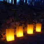 Everything you need in one complete Luminaria Kit 12 LumaBases Patented water filled candle holder that requires no messy sand and is