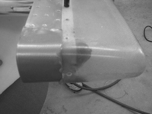 Note the duct tap over the aluminum to keep the resin from sticking to that area. And a finished rudder cap!