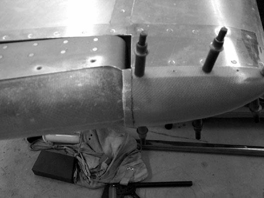 Rivet the tip in place using AN426A3-5 rivets (soft rivets).