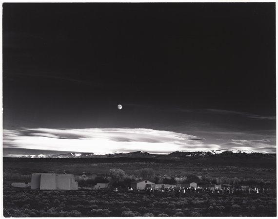 Moonrise, Hernandez, New Mexico (1941) Early gelatin silver print 15-5/16 x 19-1/2 inches, mounted Signed in ink on mount; with photographer's earliest Carmel, California ink stamp, titled and