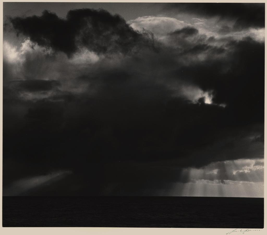Sunset, Timber Cove (ca. 1963) 9-1/2 x 11-1/16 inches, mounted Signed in ink on mount; with photographer's Timber Cove Inn ink stamp, titled in ink, on mount verso.