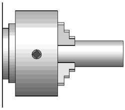 The work piece (metal bar) is secured to a rotating three jaw chuck.