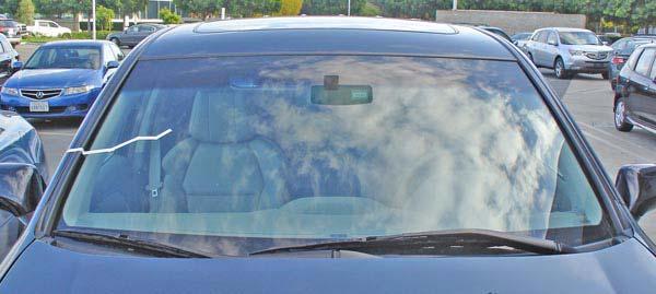 Photo Two: Take a photo of the windshield with all four corners, the rearview mirror,