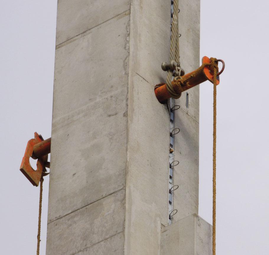 and handling of precast concrete elements such as columns or precast beams. The mounting system can be remotely released with a cord.