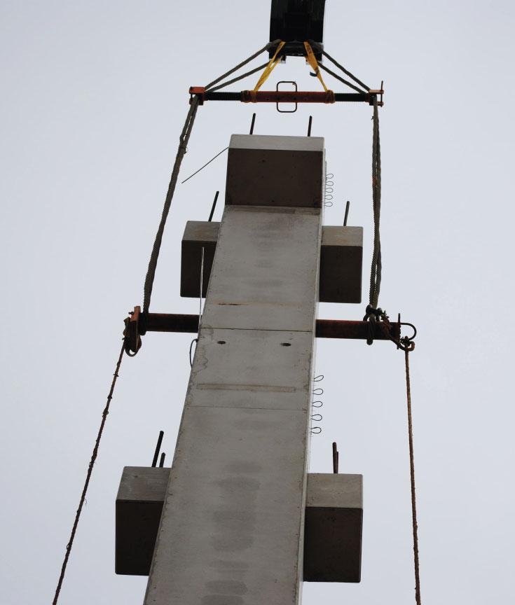 The system consists of a mounting shaft with a slip guard and a rope strut and serves as a mounting device for lifting, moving, and placing precast concrete