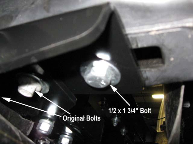 Slide the beam assembly into position between the frame rails from underneath the vehicle. Refer to the illustration for correct orientation. 12.