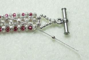 spacer, round bead and spacer, and back up the other side, through the 4 round beads, the spacer and the