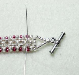 Take your needles and go through the spacer bead, the four round beads and pull the thread tightly.