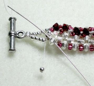 bracelet in a straight line. Tie a knot on the existing thread and bead through some more beads in the line.