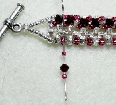 On your needle, put one size 15 seed bead, one 3mm crystal and one size 15 seed bead.