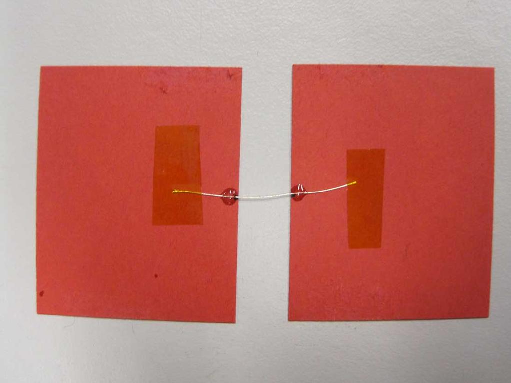 (a) (b) Figure 2.8: Short yarn sections are glued onto pieces of cardboard.