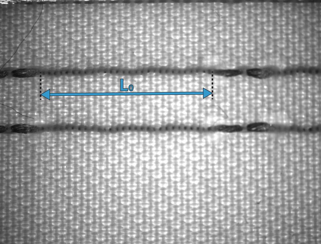 (a) Undeformed sample. (b) 3.0% extension. (c) Conductive yarn at the float on the right fails at 11.