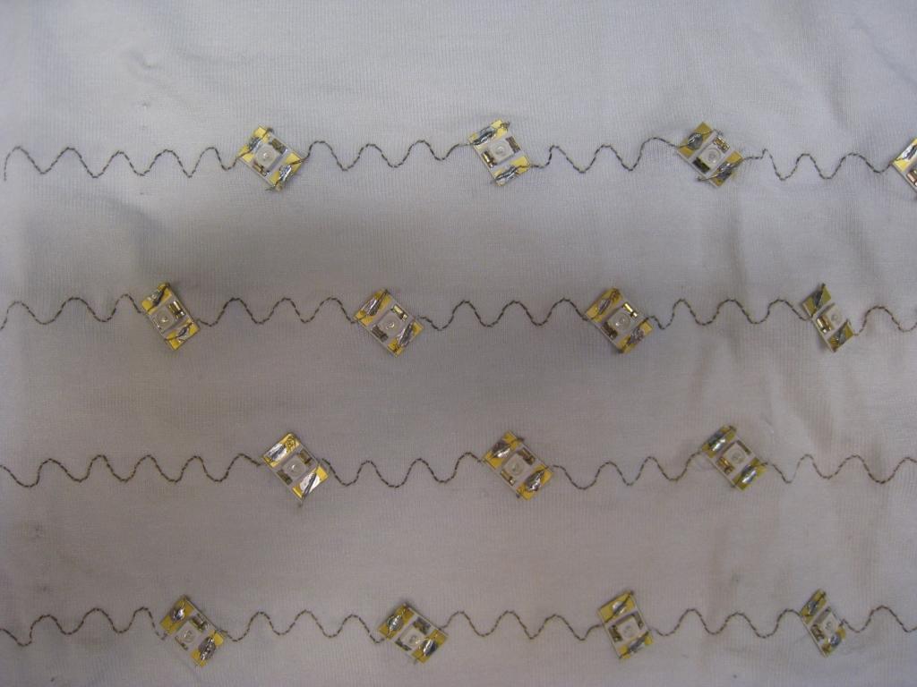 Figure 4.4: Embroidered stretchable circuit connecting to LEDs, developed at Philips Research.