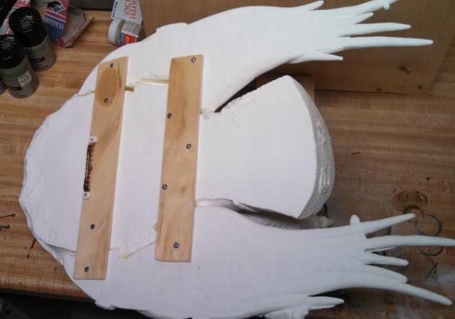 Then I attached a saw tooth picture hanger to the back so I could secure the Predator to its temporary painting stand.