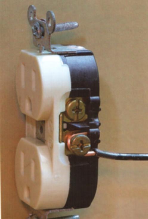 Insert the wire from the front of the receptacle then bend it around