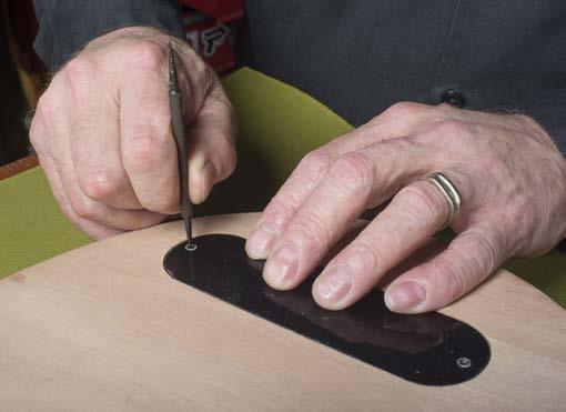Drill for cover plates and pickguard Use a sharp point, such as a scribe (#1672), to mark out the mounting holes for the control cavity and pickguard.