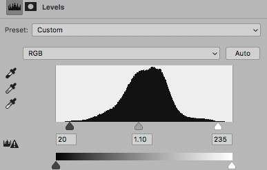 To make these adjustments I move the sliders (the small triangles) in the Levels dialogue box. Notice that there is a bar below the histogram that shows a gradient from total black to total white.
