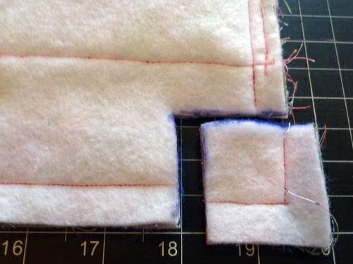 11. Flatten the corner. 12. Double stitch the corner, using a ½" seam allowance. 13. Repeat to create the opposite corner. 14. Press open the seam allowances as best you can.