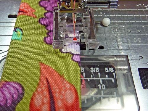 8. Lock the stitch. Then repeat to edgestitch the opposite end of the handle. 9. Replace the original marking pins if necessary. 10.