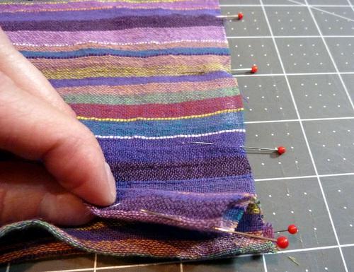 6. When you're finished with the pleats, the band should measure 1½" wide. Pin the raw ends together on each side. If your fabric is hard to handle, you could hand baste the raw ends in place.