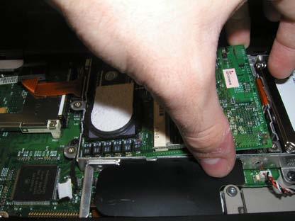 If the processor does not easily come out, simply try another location in the bottom right hand corner.