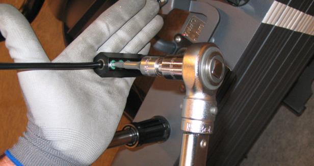 using a torque wrench.