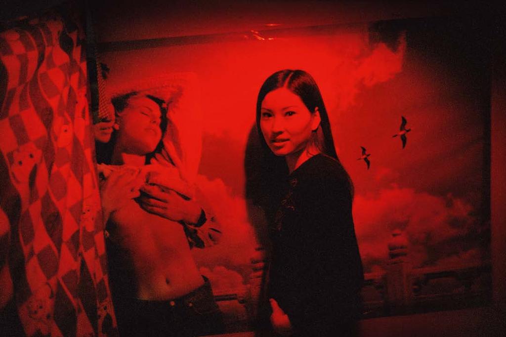 Feature Patrick Zachmann Portrait of a young prostitute from Henan in a massage parlour, Beijing 2001 (above).