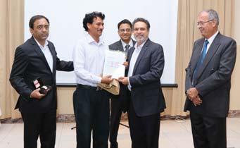 receives his award from Mr. Srikant Srinivasan Mr. Manab Pore.