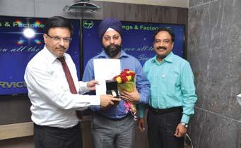 Construction Manager (Civil) (B&F IC), receives his award from Mr.