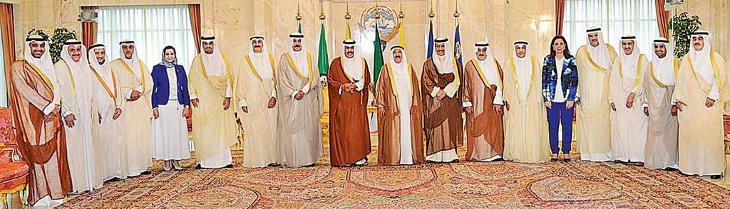 LOCAL KUWAIT: Members of the newly-appointed Kuwaiti Cabinet pose for a group photo with His Highness the Amir Sheikh Sabah Al-Ahmad Al-Jaber Al-Sabah after their swearing-in ceremony yesterday.