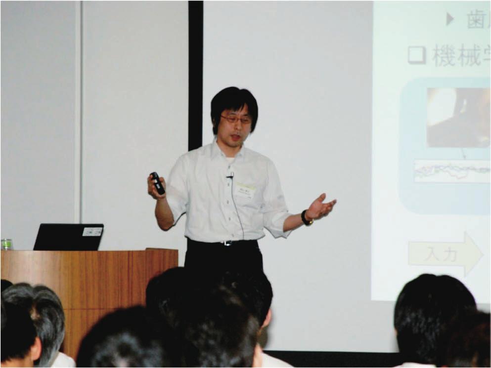 Photo 4. Research talk by Dr. Yoshiyuki Suyama. Photo 5. Research exhibits.