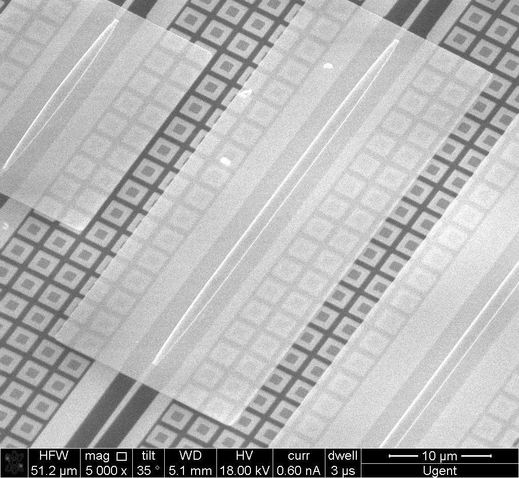This quantum well stack is sandwiched between two 25 nm thick InP cladding layers. The band gap wavelength for this configuration was determined to be 1.58 μ m.