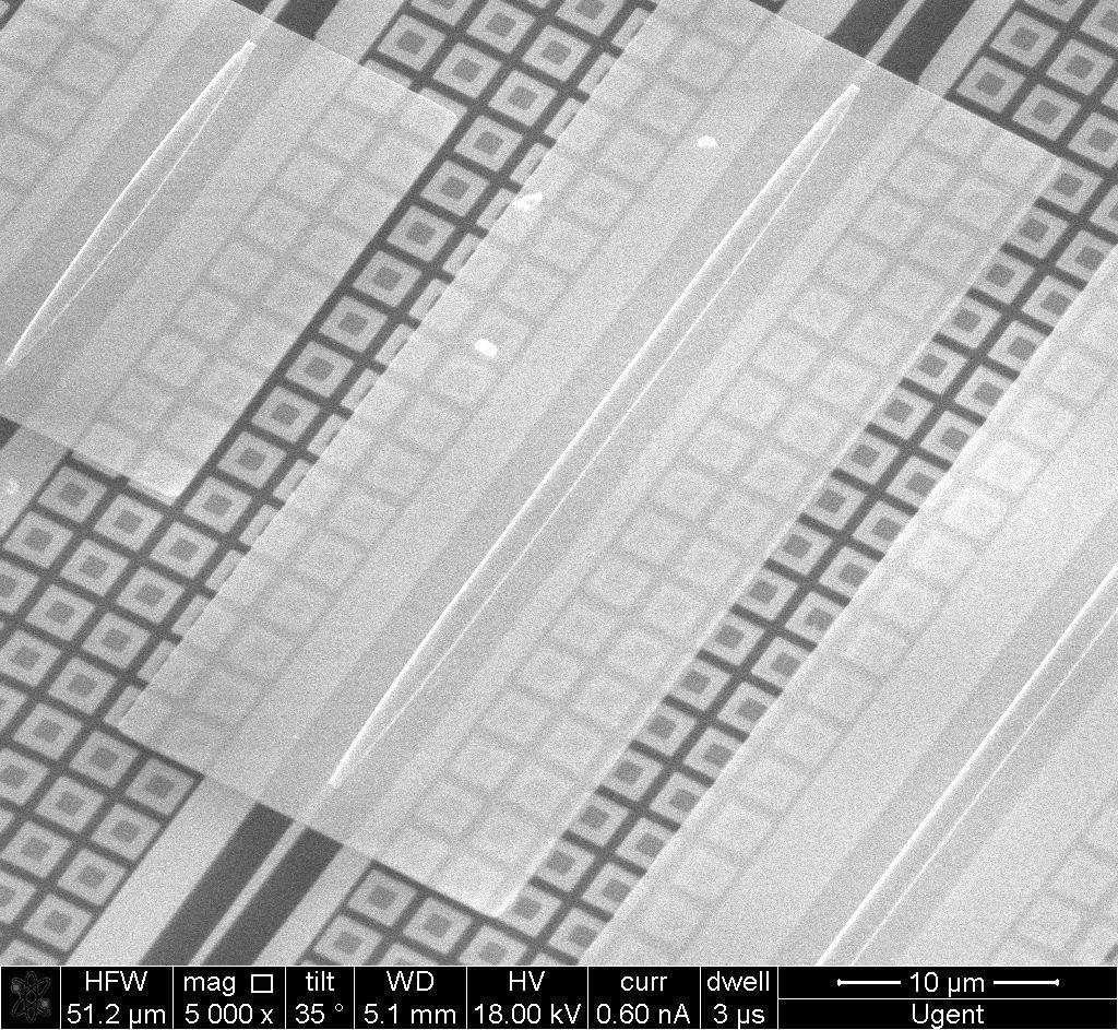 It is made by shallow etching a bonded III-V epitaxial layer stack, which consists of three 8 nm thick InGaAs quantum wells, separated by nm thick InP barrier layers.