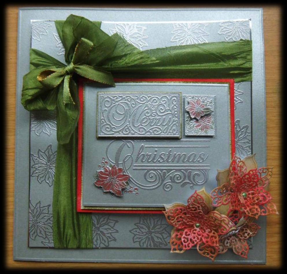 How to make a... Sue Wilson Filigree Poinsettia Card Here is the completed project. The Creative Expressions Merry Christmas panel stamp makes for a STUNNING centre to a Christmas card.