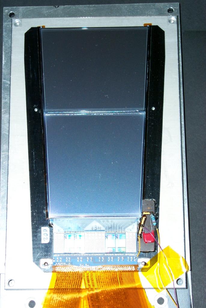 A module, connected to the front-end electronics and glued on a carbon fiber support is shown in Fig. 2.8.