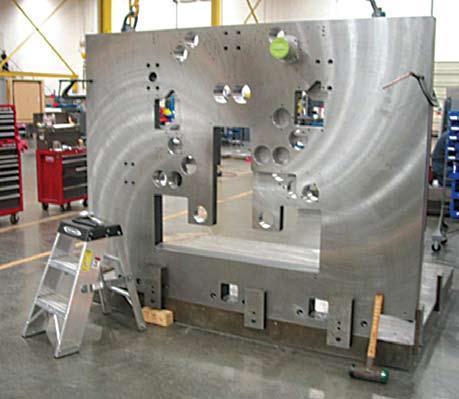 Horizontal milling of a small frame Milled side frame for a QTI folder Single spindle five-sided machining capability with five-degree indexing 192" (X) x 125" (Y) x 31"