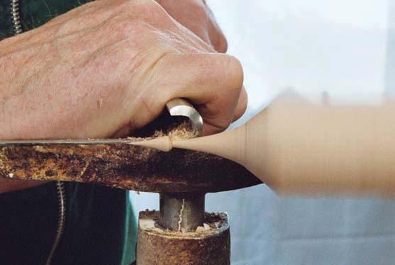 For delicate work like the icicle segments of a Christmas ornament, turn the gouge on its side. With a soft touch, you can complete this piece supported only by the chuck (no tailstock).