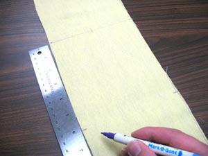 Starting at the center line, draw a mark 6 inches down on each side of the panel.