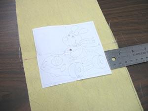 Create a paper template of the design by printing it at full size using embroidery software. Trim around the designs to make them easy to place.