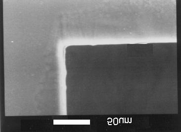 Fig. 4 Etch rate vs. fluence for polyimide Fig. 5 Smoothly etched polyimide at 1.7 J/cm 2 