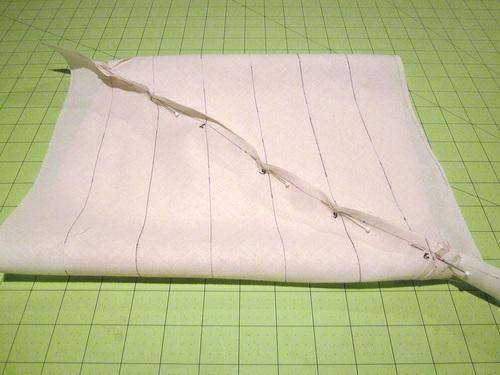 25. Bring the fabric tube to your sewing machine. 26. Sew along the drawn ¼" seam line where you matched the numbers.