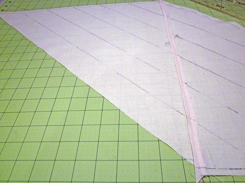 These lines should intersect with the ¼" seam lines marked at the top and bottom. 18.