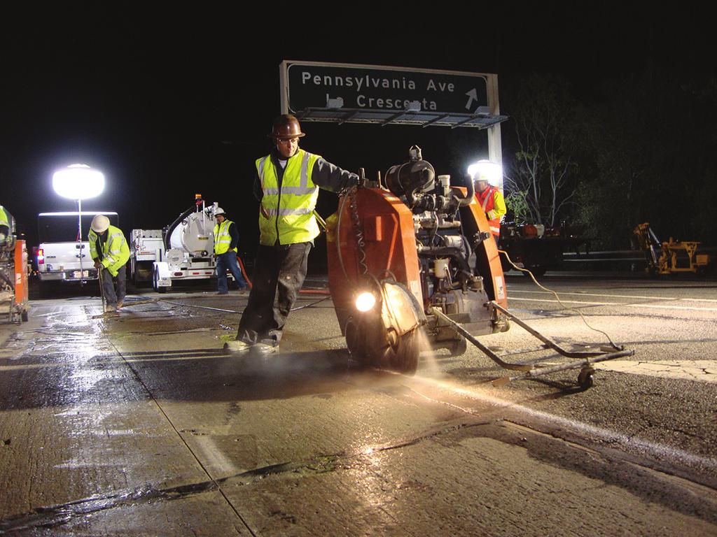Figure 8.17. This sawing crew is equipped with adequately sized saws, proper lighting, a water supply and a slurry suction truck. Figure 8.18.