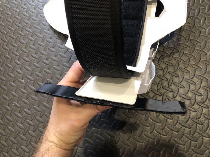 18 Affix three strips of hook side industrial velcro to the COD plate as shown, and attach the plastic belt so that the corresponding velcro pieces lock together.