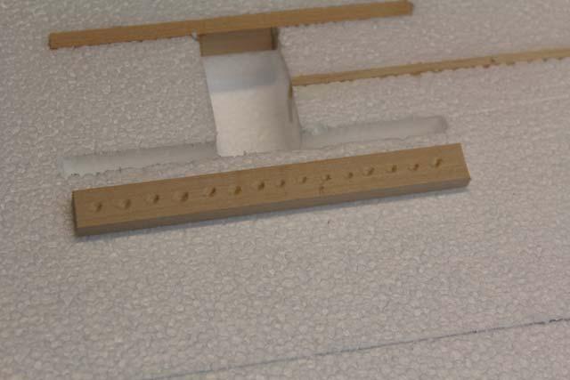 Use a router or hotwire jig to cut the servo wire channel.