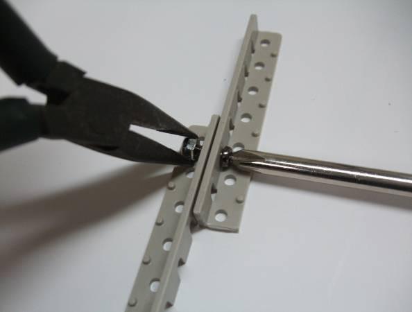 Removing these shown in photo 3.6. protrusions will make it easier to secure the angle pieces with screws.